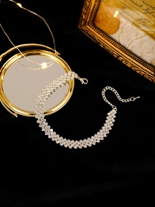 Detailed view of silver triple-row rhinestone choker with adjustable lobster clasp