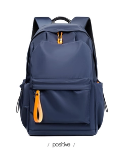 Deep blue waterproof backpack detail showing large zipper pocket with orange accent