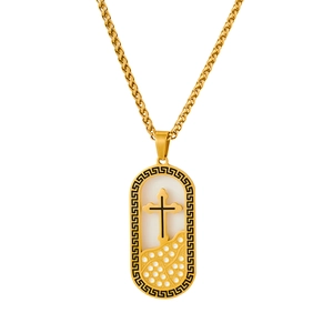 Macro shot of 18K gold plated cross pendant with greek key border and inlaid crystal