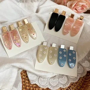 Sweet candy-colored teardrop hair clips set in diverse trendy acrylic and resin patterns
