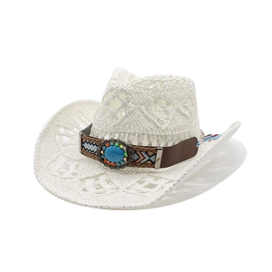 Close-up of white crochet cowboy hat with turquoise and ethnic woven headband detail