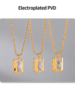Detailed macro view of three rectangular zircon pendants with golden PVD twisted chains
