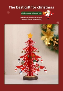 Detail of wooden Christmas tree desk decor with colorful ornaments and star topper