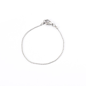 Minimalist silver bead bracelet and anklet with lobster clasp on a clean white background