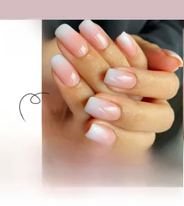 Detail of pink and white gradient French tip press-on nails in short trapezoid shape