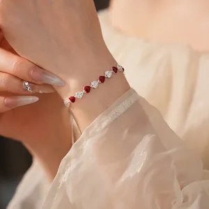 French vintage silver heart link bracelet with red enamel and zircon on female wrist