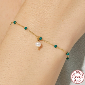 Elegant 925 sterling silver bracelet with turquoise beads and a white pearl pendant