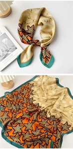 Detail of silk square scarf showing folded texture and floral print patterns