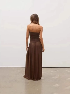 Deep brown strapless backless maxi dress with pleat details and a flowing loose silhouette