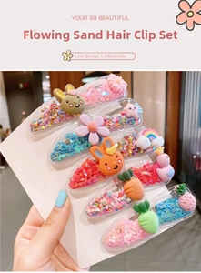 Close-up of cute children's glitter hair clips with cartoon resin shapes and sequins