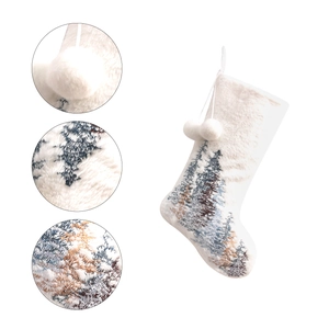 White plush Christmas stocking with snowflake tree embroidery and double pom-poms details