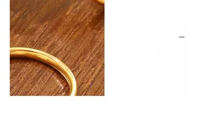 Detailed macro view of an 18k gold plated stainless steel ring with a Chinese Fu character
