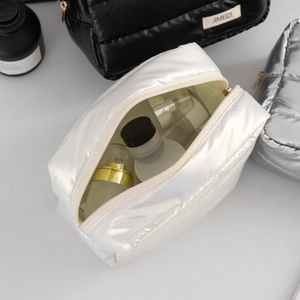 Quilted pearl white cosmetic bag featuring large capacity and smooth zipper storage