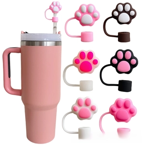 Detailed close-up of pink cat paw silicone straw cover cap on a large tumbler straw