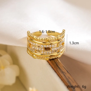 Detailed macro view of gold hollow wide ring with cubic zirconia and size dimensions