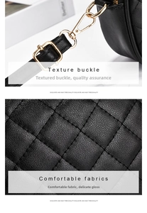 Detail of black quilted leather texture and premium gold-tone metal hardware clasp