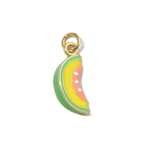 Macro shot of melon-shaped enamel pendant with golden trim for DIY jewelry making