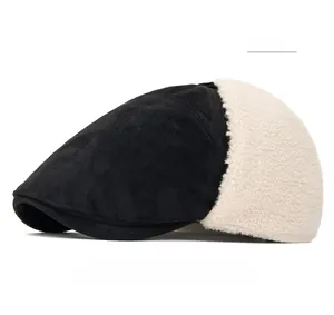 Detail of winter newsboy hat featuring black suede fabric and warm faux shearling earflaps