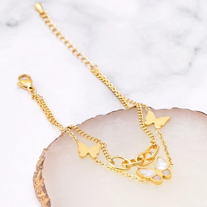 Elegant 18k gold double-layer butterfly bracelet with white shell and geometric links