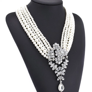 Luxurious multi-layer pearl necklace with a crystal waterdrop pendant on a black bust
