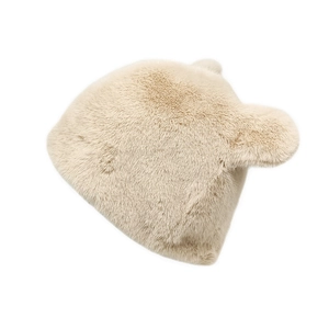 Detailed view of plush bear ear hat in beige faux mink fur with soft thick texture
