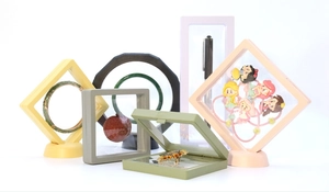 Detail view of colorful PE film floating display boxes in square and round shapes