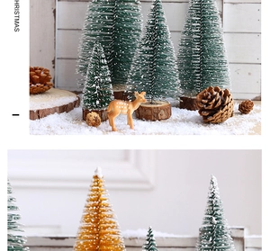 Close-up of mini sisal Christmas trees with reindeer and pine cones on faux snow