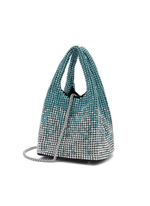 Detailed view of silver and blue gradient rhinestone bucket bag with metal chain strap