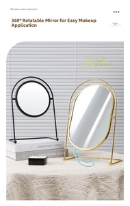 Detail showing 360 degree rotation feature of desktop iron makeup mirror on stand
