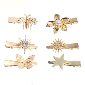 6-piece gold hair clip set with pearl flowers, butterflies and rhinestone star shapes