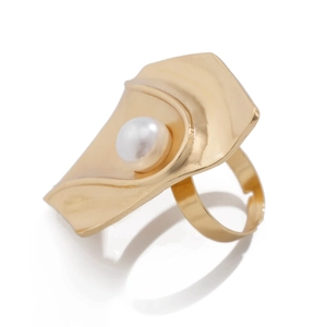 Detail of a textured golden metal leaf ring with a central pearl and adjustable band