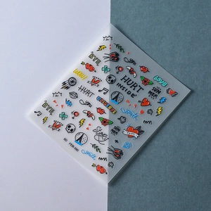 Detailed macro view of 5D embossed nail stickers featuring colorful hearts and graffiti