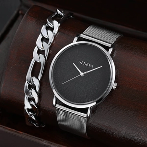 Close-up of Geneva men's watch with black dial, silver mesh strap and matching Cuban bracelet