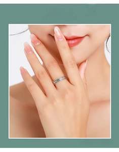 Detailed view of vintage S925 sterling silver stacked rings with textured bead edges