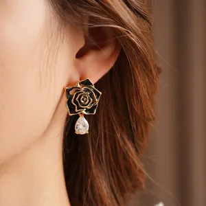 Vintage black enamel flower earrings with crystal drop charms for a luxury retro style
