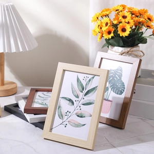 Minimalist wooden picture frames set in natural and dark wood, white, and black finishes