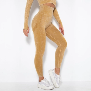 Detail of high-waist acid wash yoga leggings and long sleeve top with ribbed side textures