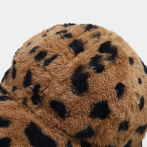 Close-up detail of plush leopard print faux fur material on women's winter baseball cap