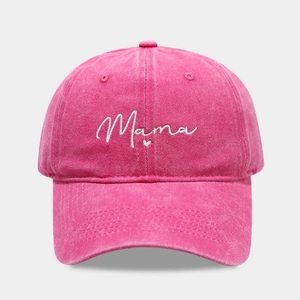 Detailed close-up of Mama and heart embroidery on a rose pink washed cotton baseball cap