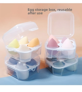 Detailed view of 4-grid clear storage boxes with 16 colorful teardrop makeup sponges