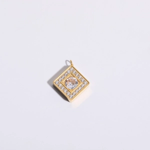 Detailed view of square gold plated pendant featuring a central zircon stone and halo crystals