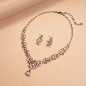 Detail of leaf and flower jewelry set with lavender rhinestones and teardrop pendant