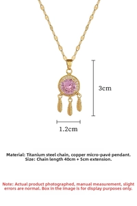 Detailed view of gold feather dreamcatcher necklace with pink stone and size measurements