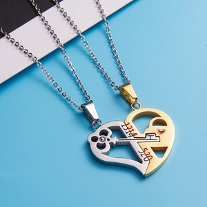 Detailed shot of interlocking heart pendants with 520 and 1314 engraving on blue surface