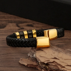 Handcrafted woven black leather bracelet for men featuring a gold magnetic clasp