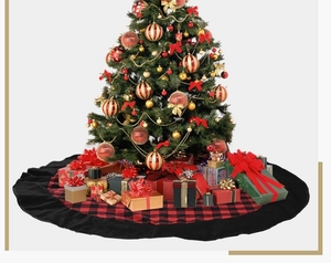Detail of red and black buffalo plaid Christmas tree skirt with ruffled edge decor
