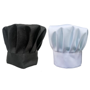 Close-up of pleated chef hats in black and white colors for catering and kitchen staff
