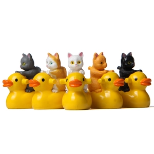 Set of 5 miniature figurines featuring colorful cats riding small yellow rubber ducks