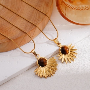 Bohemian gold sunburst pendant necklace with brown tiger eye stone on snake chain