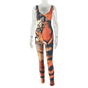 Detailed view of the tiger print jumpsuit featuring chest cutout and slim fit design